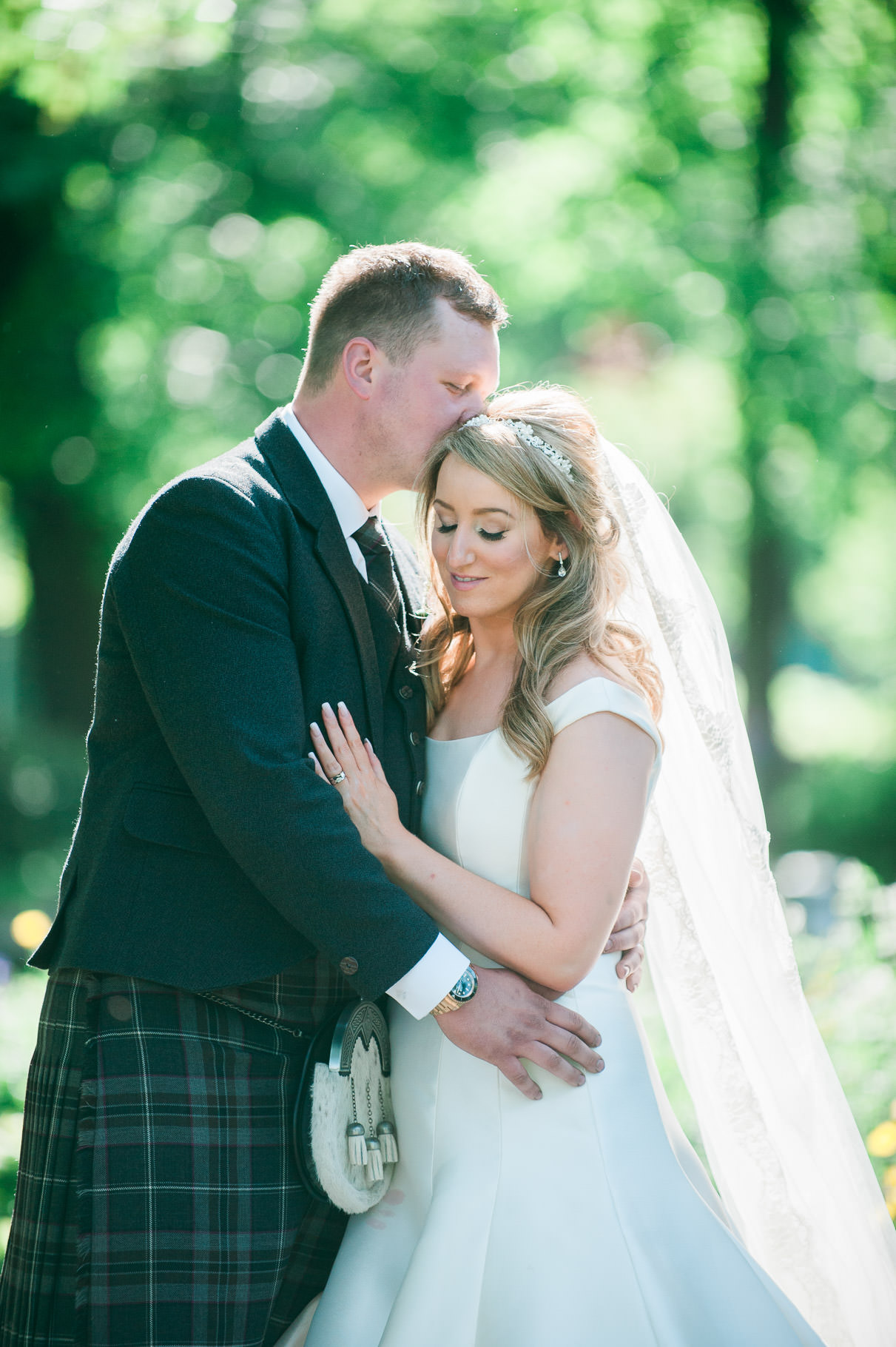 Summer Wedding in Scotland at House For An Art Lover-bride and groom embrace-backlit bride and groom