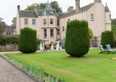 Bridal party in gardens of Myres Castle in Fife